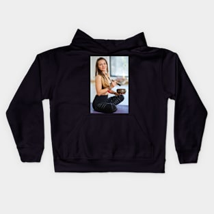 Woman with a tibetan bowl Kids Hoodie